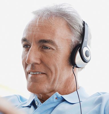 Older man with headphones on