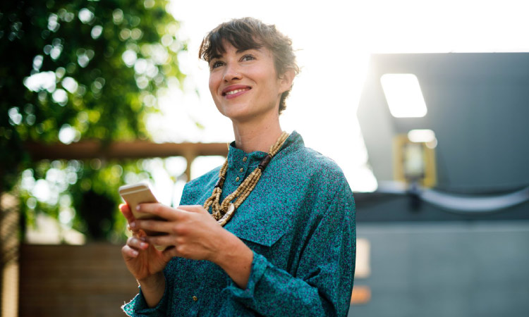 smiling woman with phone