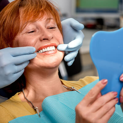 A woman sitting in a dentist's chair