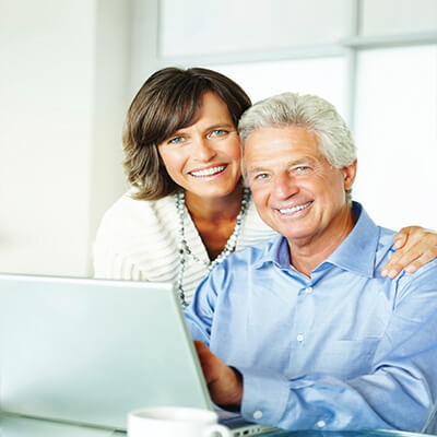 husband and wife with computer