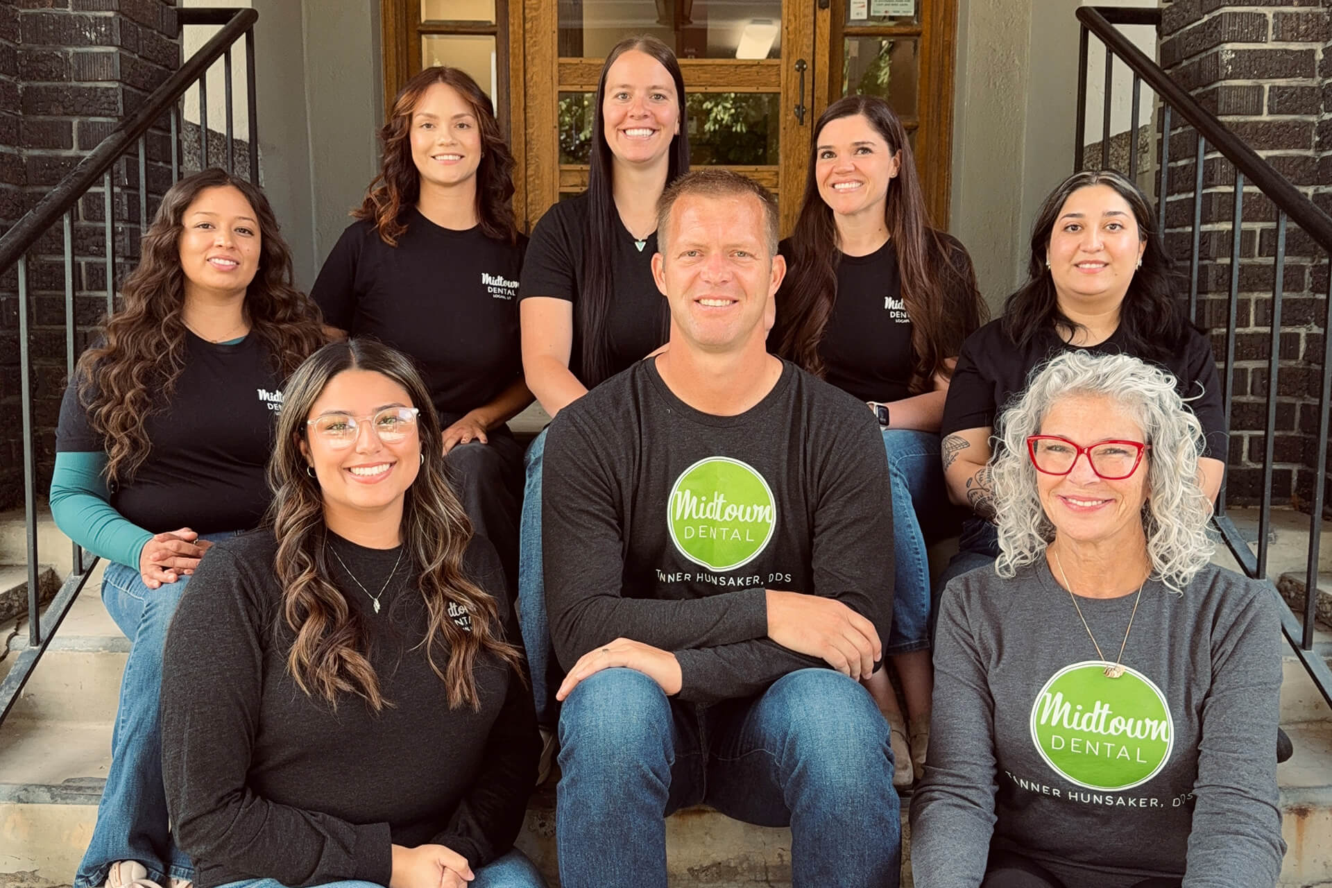 Dentist in Logan, Dr. Tanner Hunsaker and his dental team group photo at Midtown Dental in Logan, Utah